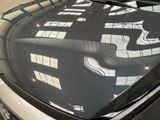 a reflection of a cat on the windshield of a car