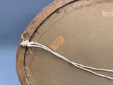 a close up of a hat with a rope on it