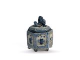 blue and white porcelain box with a lion on top of it
