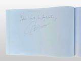 a picture of a book with a handwritten quote on it