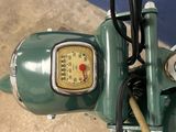 a close up of a motorcycle with a speedometer on the handlebar