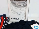 a box that has a pair of socks and a hat on it