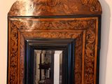 a picture of a mirror hanging on the wall