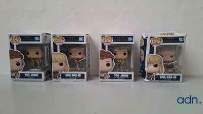 three funko pop vinyl figures of harry potter and hermion