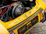 a close up of the engine of a yellow car
