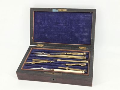 a wooden box with a set of tools inside of it