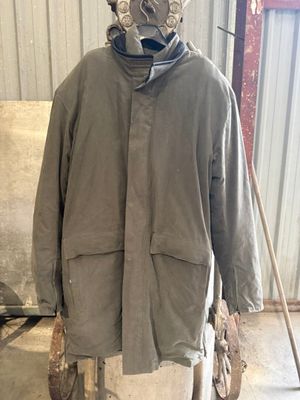 an image of a man wearing a gas mask in a garage