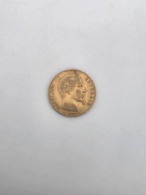 a gold coin with a portrait of a man on it