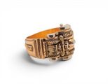 a close up of a gold ring on a white background