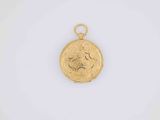 a gold locke with a face on the front of it