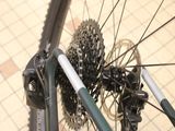 a close up of a bicycle wheel with a chain attached to it