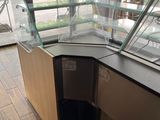 a glass display case in the corner of a store