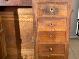 a wooden desk with a mirror on top of it