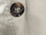 a button on the back of a jacket with a button on it