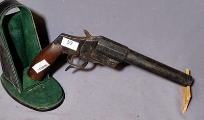 a gun that is sitting next to a pair of shoes