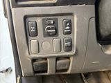 a close up of a car ' s dashboard with buttons and controls