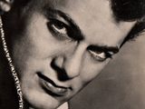 black and white photograph of a man with a serious look on his face