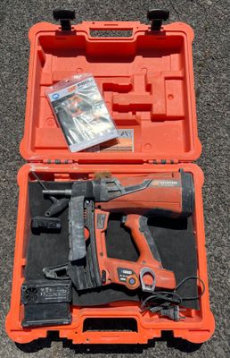 a tool kit in a plastic case on the ground