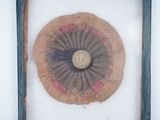 a picture of a button on a piece of cloth