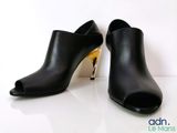 black leather high heeled mules with gold heel