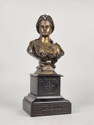 a bronze busturine of a woman on a pedestal