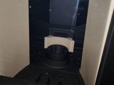 a black and white toilet in a small room