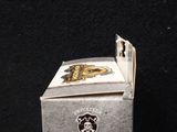 a small box with a skull and crossbone on it