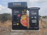 two vending machines on the side of the road