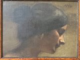 portrait of a woman in profile with her eyes closed by a wooden frame