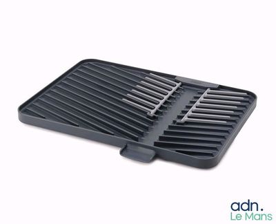 a close up of a black grill pan on a white background