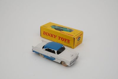 dinky toy car with box on white surface with white background