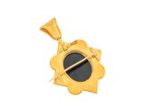 an image of a gold pendant with a black stone in the center