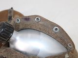 a close up of a metal object with a metal object in it