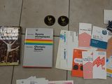 a lot of books on the floor next to a pair of shoes