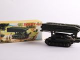 an image of a toy tank with a box on a white surface