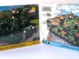 two boxes of lego military vehicles on a table