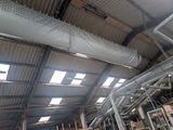 a large metal pipe in the middle of a building