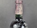 a bottle of wine that is sitting on a table