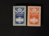 two small playing cards sitting next to each other on a table