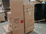 a pile of boxes sitting on top of a pallet in a warehouse