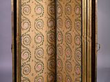 an antique wooden folding screen with a floral design on it