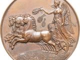 a bronze medal with a horse and a woman on it