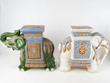 three ceramic elephant figurines sitting next to each other