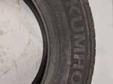 a close up of a tire on a wall with a white background