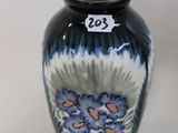 a vase with a number 23 on it sitting on a table