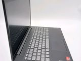 a laptop with a black keyboard sitting on a white surface