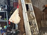 a ladder leaning up against a wall in a garage