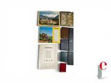 a picture of a collection of books on a white surface