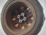 a close up of a tire on a white surface