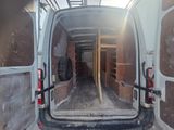 a white van that is parked inside of a building